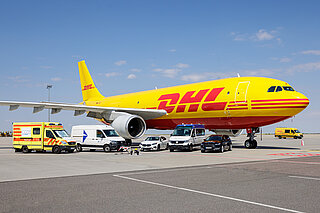 Tri5G Ambulance, transport vehicle, robot dog, and aircraft on the runway