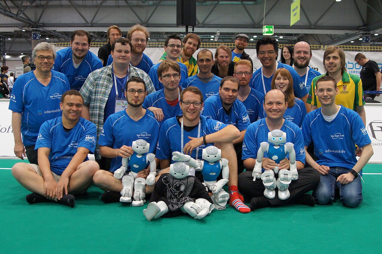 Group picture of the Nao Team HTWK Leipzig with their roboter soccer