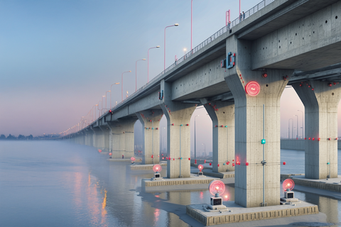 Eine große Betonbrücke über Wasser mit vielen leuchtenden Sensoren und Geräten