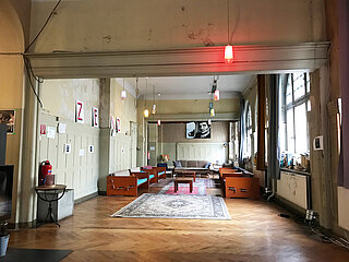 An artistically decorated room with sofas and tables