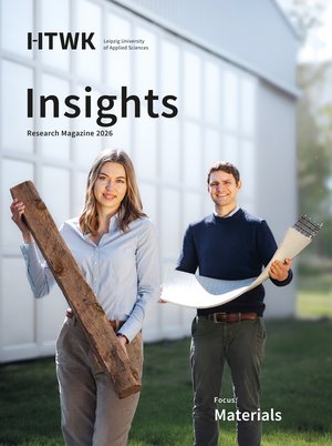 a woman and a man holding materials