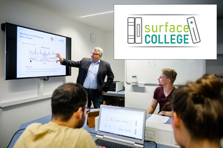 surfaceCOLLEGE A lecturer explains a technical diagram while the students follow along