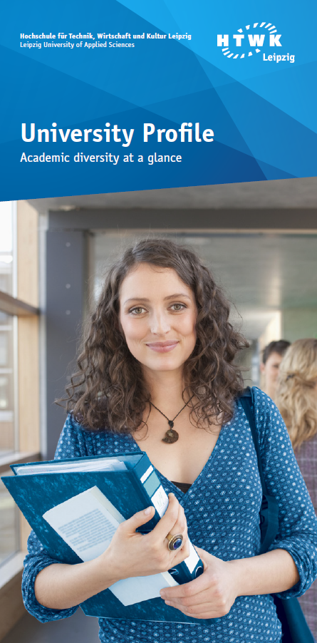 Student holding a stack of folders